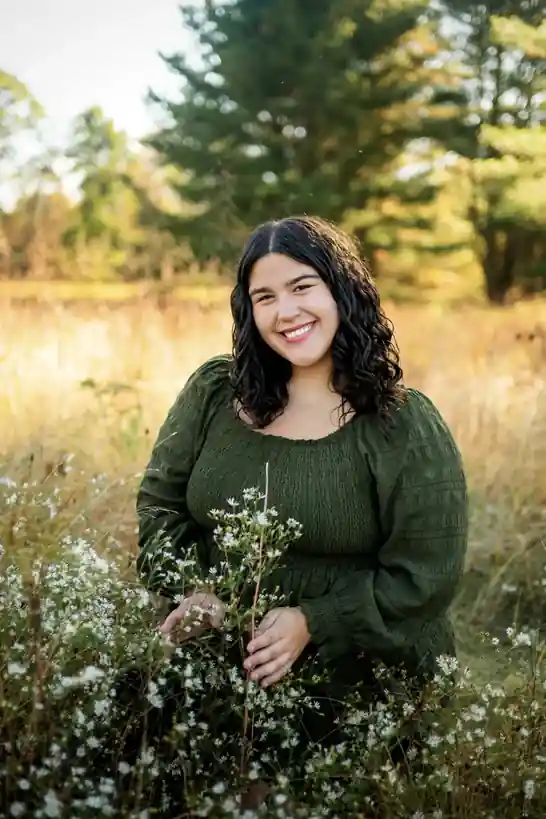 2026 Carl E. Stotz Little League Baseball Scholarship: 14 Winners 4 Alison Bilbay smiling in a wildflower field during an outdoor portrait session